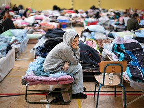 Women and children who have fled war-torn Ukraine rests in a shelter set up in a primary school close to the Ukrainian border on March 21, 2022 in Przemysl Poland.