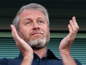 In this file photo taken Aug. 15, 2016, Chelsea's Russian owner Roman Abramovich applauds ahead of a Premier League match between Chelsea and West Ham United at Stamford Bridge in London.