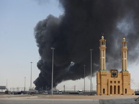 Smoke billows from a Saudi Aramco's petroleum storage facility after an attack in Jeddah, Saudi Arabia March 26, 2022.