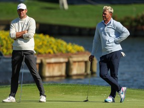 Scottie Scheffler (left) and Brooks Koepka were two of the victims of the 17th during the Players Championship on Saturday at TPC Sawgrass in Ponte Vedra Beach, Fla.