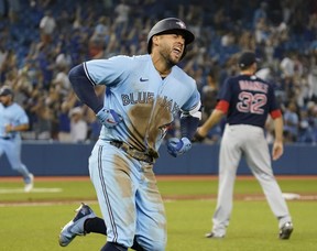 Blue Jays centre fielder George Springer celebrates after hitting the game-winning three run home run in the eighth inning against the Boston Red Sox at Rogers Centre last season. USA TODAY SPORTS