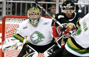 Standing on guard: London Knights goalie Steve Mason has to contend with Owen Sound’s Wayne Simmonds in front of the net during their game last night at the John Labatt Centre. (Postmedia files)