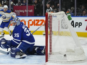 Maple Leafs goaltender Petr Mrazek (35) looks behind him after being scored on by the Buffalo Sabres' Jacob Bryson (not shown) during the first period on Wednesday at Scotiabank Arena. Toronto was playing in front of a full house after COVID measures were eased in Ontario.