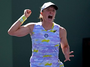 Iga Swiatek celebrates at match point defeating Maria Sakkari in the women’s final at the Indian Wells Tennis Garden in Indian Wells, Calif., March 20, 2022.