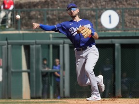 Los Angeles Dodgers shortstop Trea Turner (35) makes the play during a spring training game against the Chicago White Sox at Camelback Ranch-Glendale.