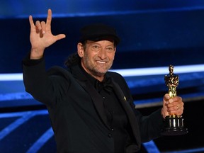 Troy Kotsur accepts the award for Best Actor in a Supporting Role for "CODA" onstage during the 94th Oscars at the Dolby Theatre in Hollywood, Calif., on March 27, 2022.