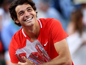 Taylor Fritz of the United States holds his winners trophy aafter his straight sets victory against Rafael Nadal of Spain in the men's final of the BNP Paribas Open at the Indian Wells Tennis Garden on March 20, 2022 in Indian Wells, Calif.