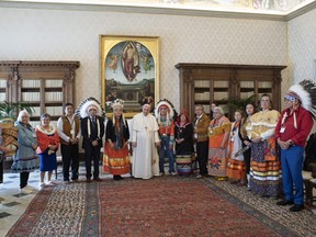 Indigenous delegates from Canada's First Nations pose for a photo with Pope Francis during a meeting at the Vatican, March 31, 2022.