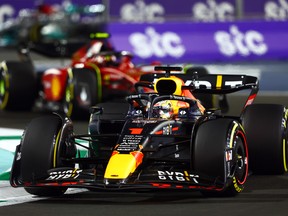 Max Verstappen eads Carlos Sainz during the F1 Grand Prix of Saudi Arabia at the Jeddah Corniche Circuit on March 27, 2022.