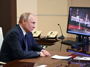 Russian President Vladimir Putin chairs a meeting with members of the Security Council via a video link at the Novo-Ogaryovo state residence outside Moscow, Russia March 3, 2022.