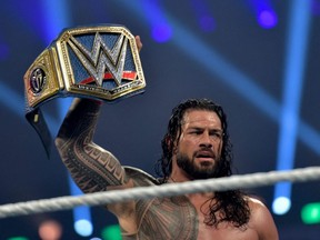 Roman Reigns celebrates after defeating Bill Goldberg during the 2022 WWE Elimination Chamber at the Jeddah Super Dome in Saudi Arabia's Red Sea coastal city of Jeddah, Feb. 19, 2022.