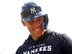 New York Yankees right fielder Aaron Judge (99) smiles during spring training workouts at George M. Steinbrenner Field.