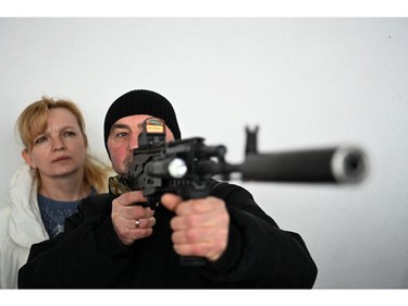 A man learns how to use a Kalashnikov assault rifle during a civilians self-defence course in the outskirts of Lviv, western Ukraine, on March 4, 2022.
