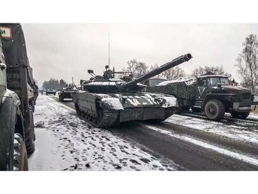 This video grab taken from a handout footage released by the Russian Defence Ministry on March 7, 2022 shows a purported Russian tank unit advancement in the Kyiv region.