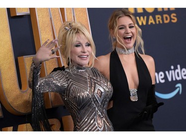 Dolly Parton, left, and Kelsea Ballerini arrive for the 57th Academy of Country Music awards at the Allegiant stadium in Las Vegas, Nevada on March 7, 2022.