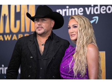 Jason Aldean and Brittany Aldean arrive for the 57th Academy of Country Music awards at the Allegiant stadium in Las Vegas, Nevada on March 7, 2022.