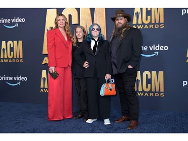 Chris Stapleton, right, with his family Morgane Stapleton, left, Chris, second from left, and Ada Stapleton arrive for the 57th Academy of Country Music awards at the Allegiant stadium in Las Vegas, Nevada on March 7, 2022.