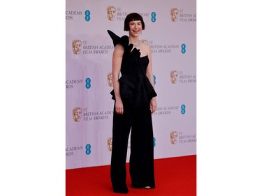 Irish actress and singer Jessie Buckley poses on the red carpet upon arrival at the BAFTA British Academy Film Awards at the Royal Albert Hall, in London, on March 13, 2022.
