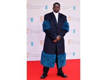 British actor Daniel Kaluuya poses on the red carpet upon arrival at the BAFTA British Academy Film Awards at the Royal Albert Hall, in London, on March 13, 2022.