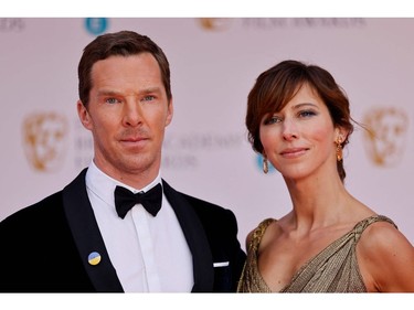 British actor Benedict Cumberbatch and his wife Sophie Hunter pose on the red carpet upon arrival at the BAFTA British Academy Film Awards at the Royal Albert Hall, in London, on March 13, 2022.