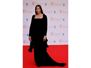 British model Naomi Campbell poses on the red carpet upon arrival at the BAFTA British Academy Film Awards at the Royal Albert Hall, in London, on March 13, 2022.