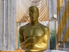 In this file photo taken on March 25, 2022, an Oscar statue is seen near the red carpet area ahead of the Oscars Award show at the Dolby Theater on Hollywood Boulevard in Los Angeles, California, on March 25, 2022.