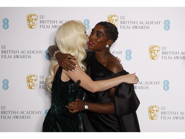 Lady Gaga embraces Lashana Lynch, who won EE Rising Star Award for "No time to die", at the 75th British Academy of Film and Television Awards (BAFTA) at the Royal Albert Hall in London, March 13, 2022.