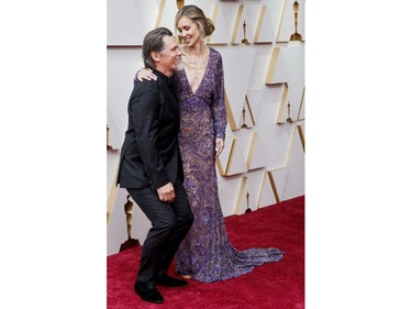 Josh Brolin and his wife Kathryn Boyd Brolin pose on the red carpet during the Oscars arrivals at the 94th Academy Awards in Hollywood, Los Angeles, Calif., March 27, 2022.