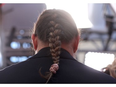 Jason Momoa's braid is seen on the red carpet during the Oscars arrivals at the 94th Academy Awards in Hollywood, Los Angeles, Calif., March 27, 2022.