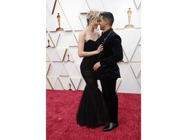 Wilmer Valderrama and wife Amanda Pacheco pose on the red carpet during the Oscars arrivals at the 94th Academy Awards in Hollywood, Los Angeles, Calif., March 27, 2022.