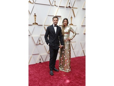 Jamie Dornan and wife Amelia Warner pose on the red carpet during the Oscars arrivals at the 94th Academy Awards in Hollywood, Los Angeles, Calif., March 27, 2022.