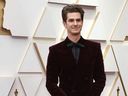 Andrew Garfield poses on the red carpet during the Oscars arrivals at the 94th Academy Awards in Hollywood, Los Angeles, Calif., March 27, 2022. 
