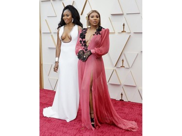 Professional tennis players Venus and Serena Williams pose on the red carpet during the Oscars arrivals at the 94th Academy Awards in Hollywood, Los Angeles, Calif., March 27, 2022.