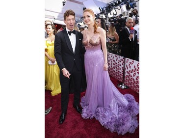 Shaun White and Jessica Chastain pose together on the red carpet during the Oscars arrivals at the 94th Academy Awards in Hollywood, Los Angeles, Calif., March 27, 2022.