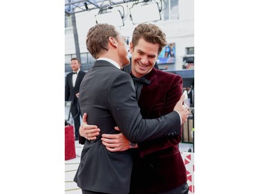 Benedict Cumberbatch and Andrew Garfield embrace on the red carpet during the Oscars arrivals at the 94th Academy Awards in Hollywood, Los Angeles, Calif., March 27, 2022.