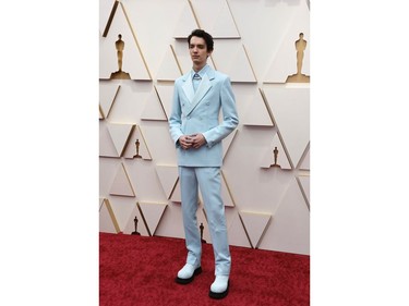 Australian actor Kodi Smit-McPhee poses on the red carpet during the Oscars arrivals at the 94th Academy Awards in Hollywood, Los Angeles, Calif., March 27, 2022.