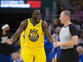 Mar 20, 2022; San Francisco, California, USA; Golden State Warriors forward Draymond Green (23) has words with referee Marat Kogut after he was assessed a second technical foul and ejected from the game during the third quarter against the San Antonio Spurs at Chase Center.