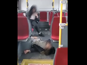 A screengrab of video posted by BlogTO of two girls, ages unknown, intoxicated on a TTC bus. The video was filmed by the driver, the TTC said.