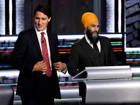 Liberal Leader Justin Trudeau and NDP Leader Jagmeet Singh take part in the federal election English-language Leaders debate in Gatineau, Canada, September 9, 2021.