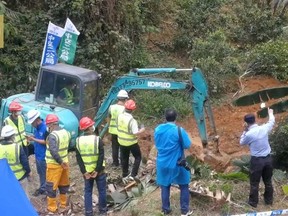 Rescuers work at the site where a China Eastern Airlines Boeing 737-800 plane, flight MU5735, crashed in Wuzhou, Guangxi Zhuang Autonomous Region, China, in this still image taken from a footage March 22, 2022.