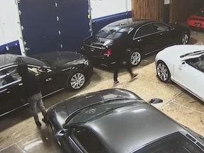 Screenshot of security footage at dealership where nearly $1 million worth of vehicles were stolen.