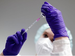 A nurse prepares a shot of Pfizer-BioNTech coronavirus disease (COVID-19) vaccine at the vaccination centre in the Humboldt Forum in Berlin, Germany January 19, 2022.
