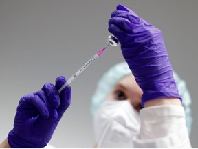 Omicron-specific COVID jabs could increase protection as boosters: EMA 2 A nurse prepares an injection of the Pfizer-BioNTech coronavirus disease (COVID-19) vaccine at the Humboldt Forum Vaccination Center in Berlin, Germany, January 19, 2022.