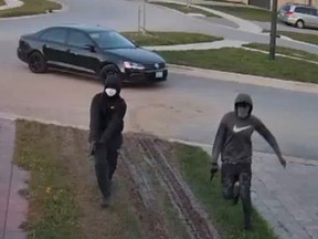 London police published this image of two suspects in the September, 2021 shooting death of a London nurse, Lynda Marques, at her upscale northwest London townhouse.
