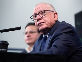 Vancouver Canucks President of Hockey Operations and Interim General Manager Jim Rutherford listens during his first news conference since being hired by the NHL hockey team, in Vancouver, on Monday, December 13, 2021.