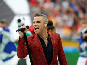 FILE PHOTO: Soccer Football - World Cup - Opening Ceremony - Luzhniki Stadium, Moscow, Russia - June 14, 2018  Robbie Williams performs during the opening ceremony