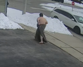 A man wrapped in a blanket is seen in surveillance footage captured during a melee Saturday, Feb. 26, 2022 in Cambridge.