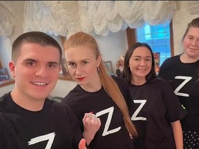 YAY VLAD! WE LOVE YOU VLAD! Former Russian spy-turned politician Maria Butina, second from left, is one Putin fangirl showing her colours.