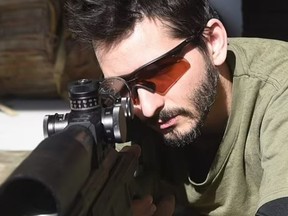 A Canadian army veteran and sniper identified as 'Wali' is hidden above the streets of Kyiv.