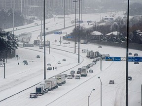 A line of disabled and abandoned cars is pictured on the eastbound lanes of Hwy. 401, between Avenue and Bayview Rds., on Jan. 17, 2022.
